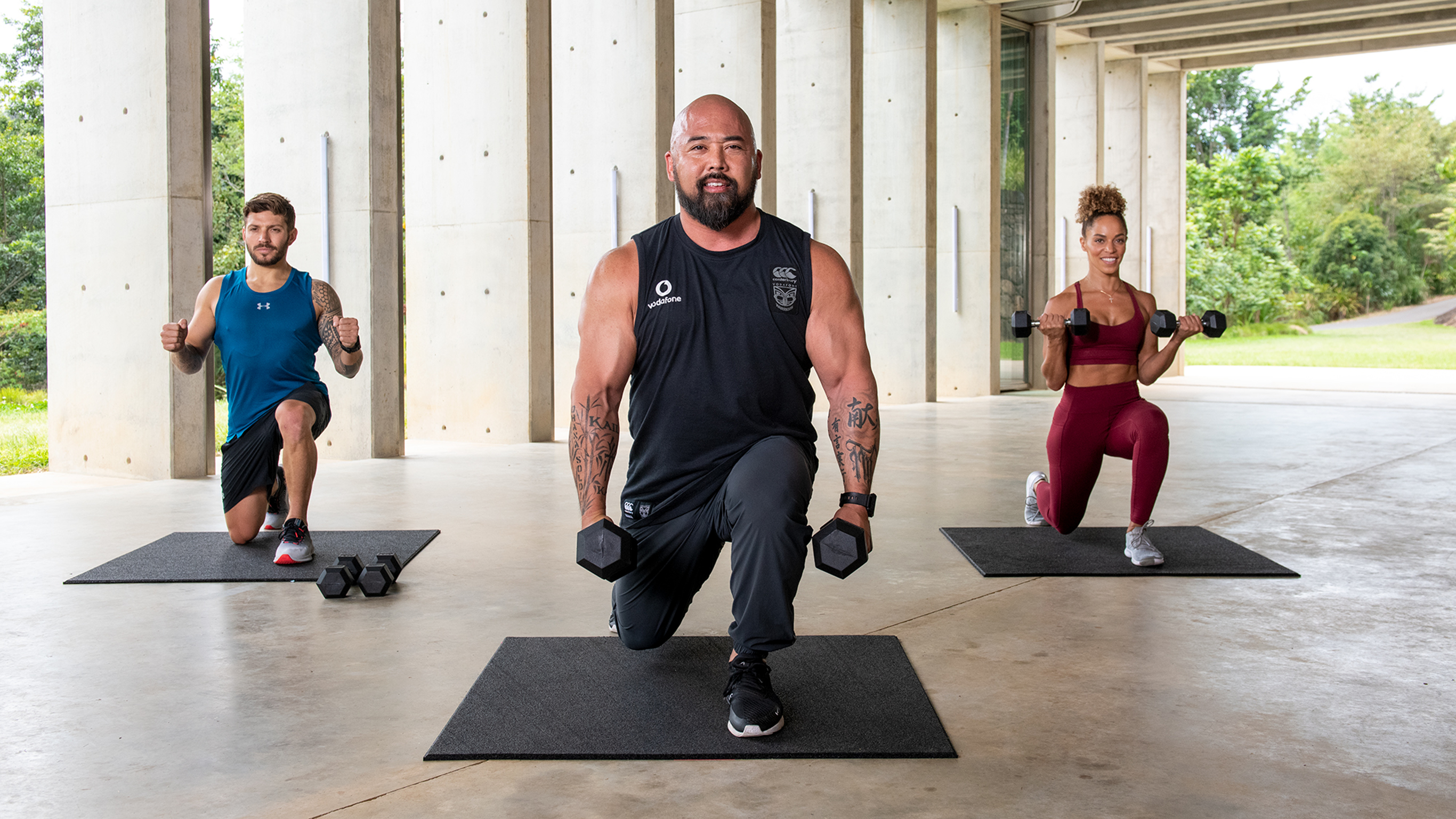 Ashley Joi, Luke Zocchi and Joseph 'Da Rulk' Sakoda doing weighted lunges.