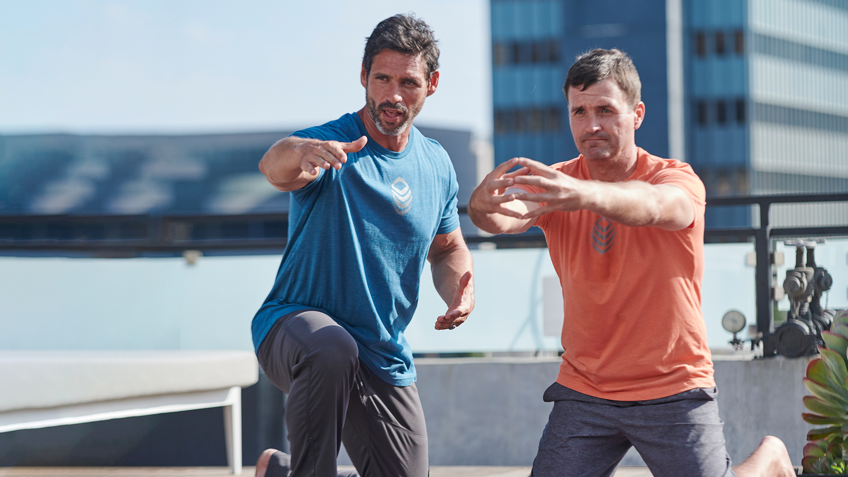Dr. Eric Goodman’s instructs a client in Foundation Training after a workout.