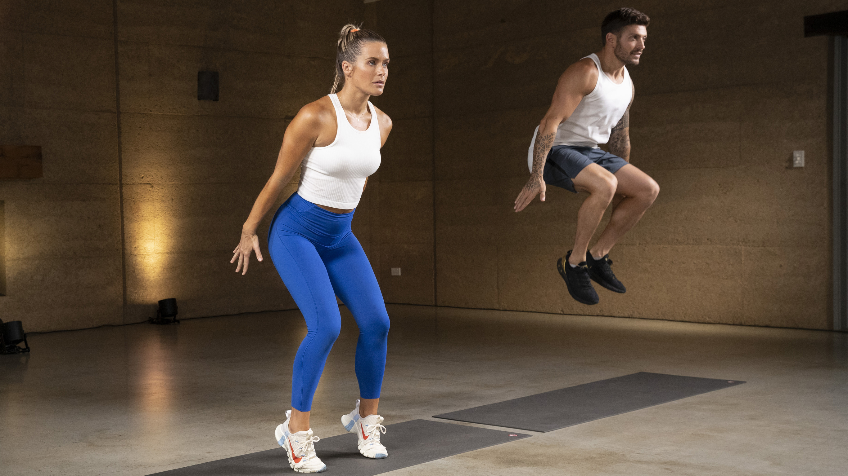 Alexz Parvi demonstrates the low-impact version of a squat jump during a Centr Unlimited workout.