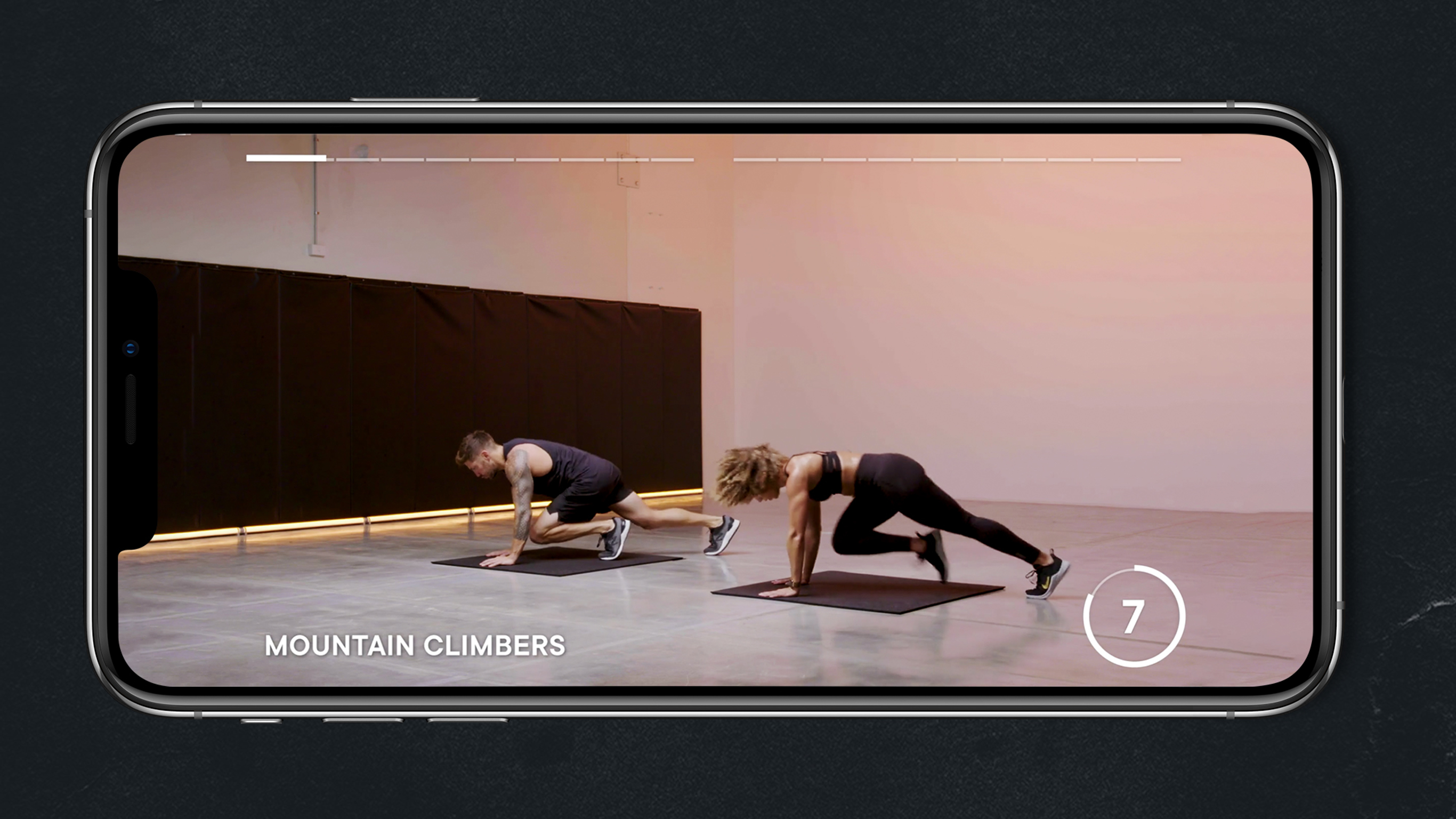 Luke Zocchi and Ashley Joi do the mountain climber exercise.