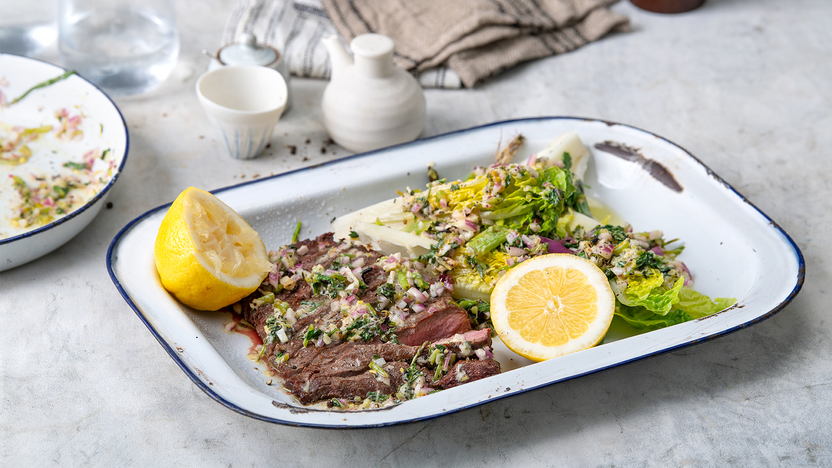 Darren Robertson’s Flat Iron Steak with Baby Cos & Charred Herb Salsa will please the guests at your next barbecue.