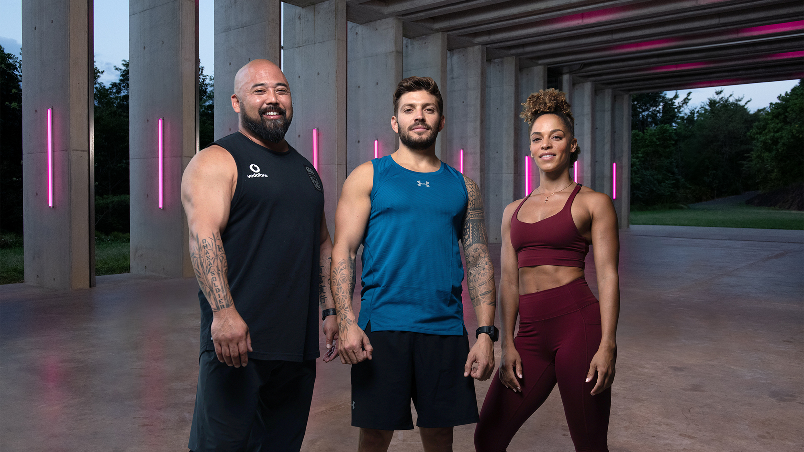 Ashley Joi, Luke Zocchi and Da Rulk stand smiling in a group.
