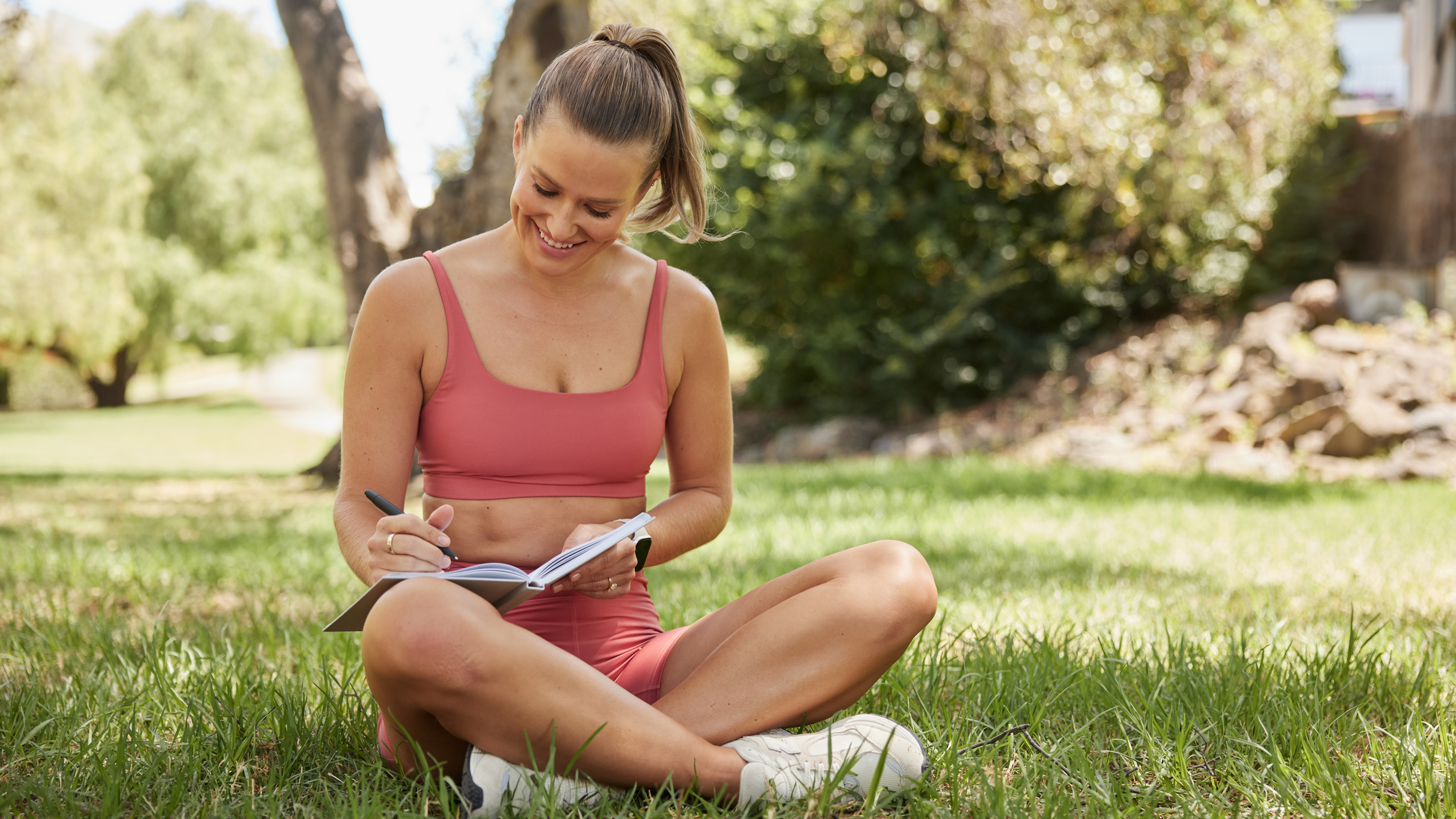 Alexz Parvi sits, journalling to help with mindfulness.