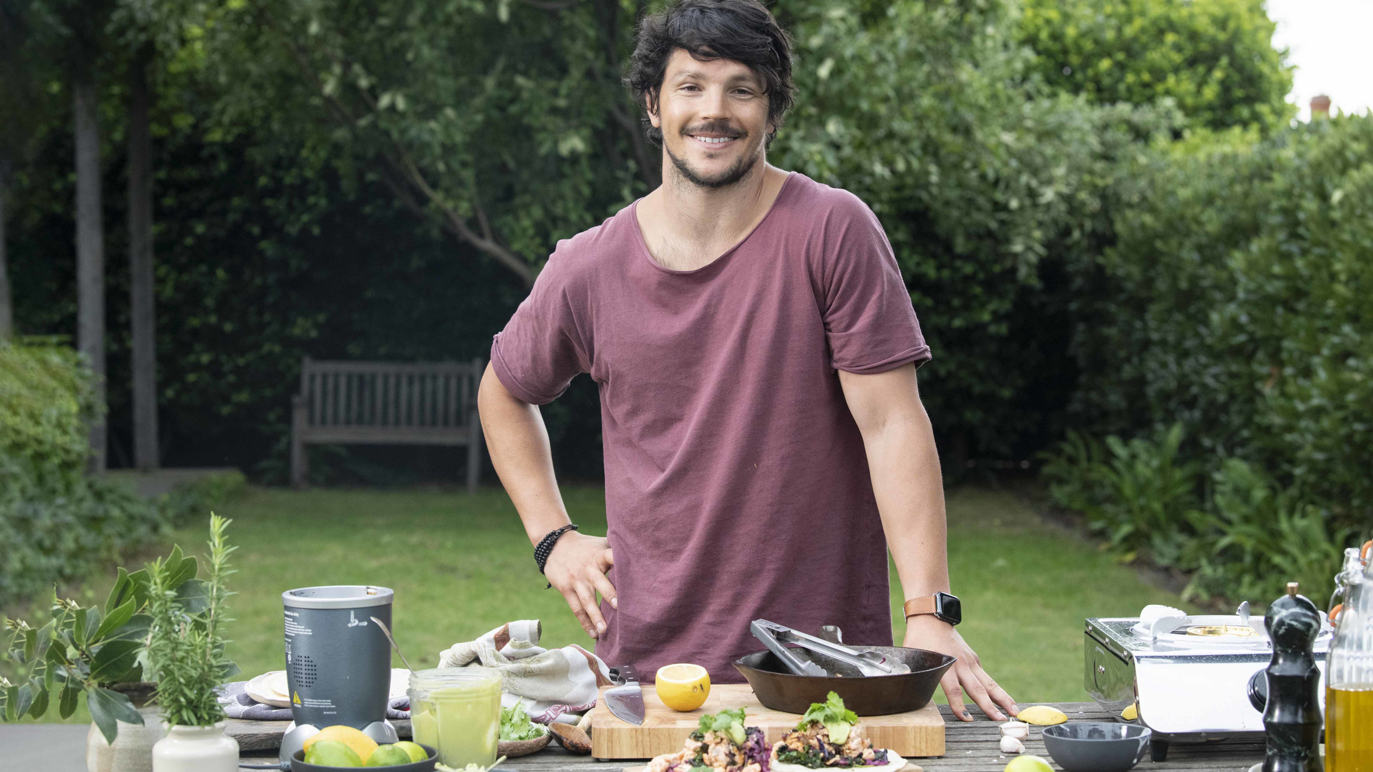 Dan Churchill cooking outside.
