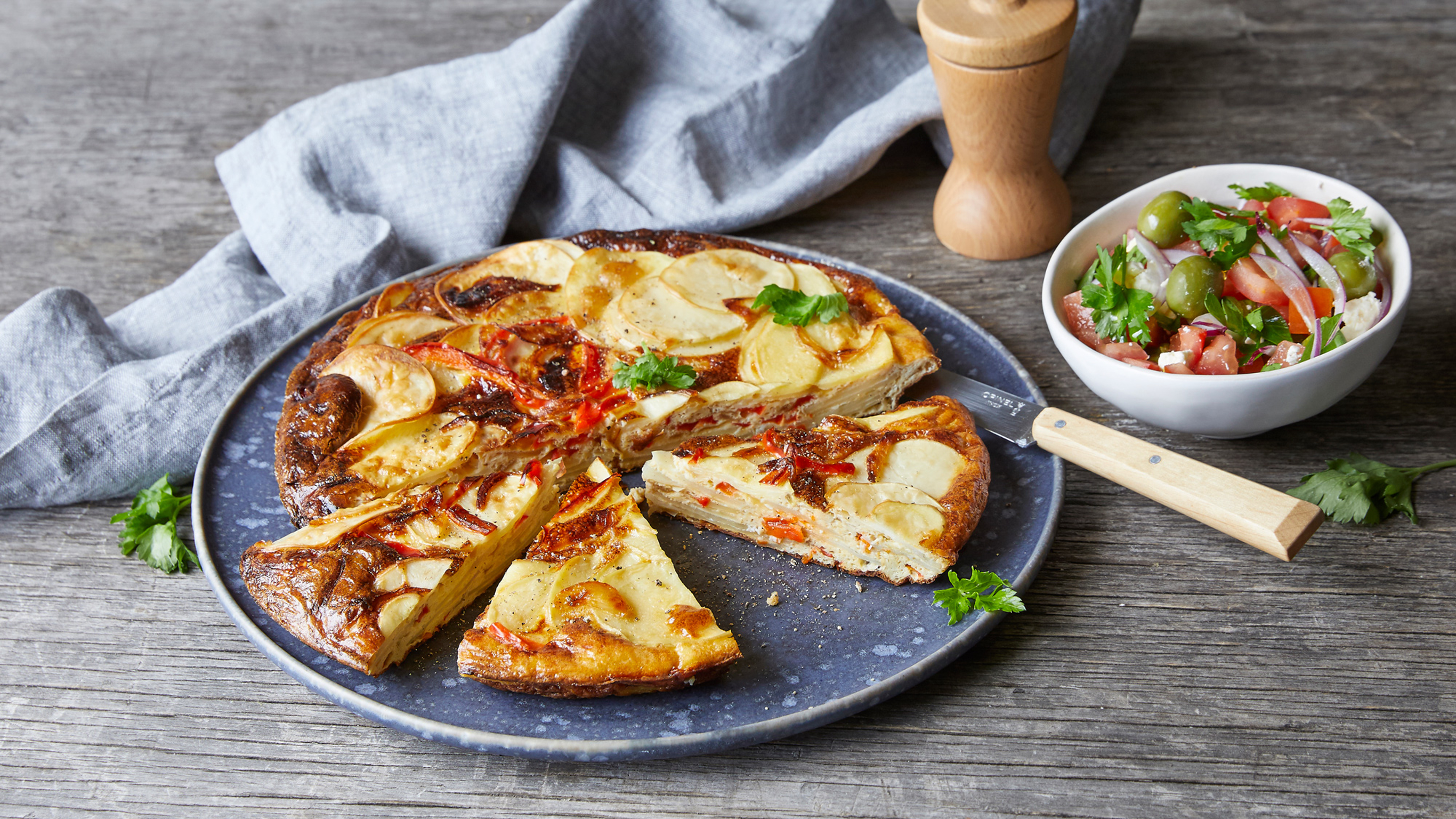Potato and Bell pepper tortilla with tomato salad.