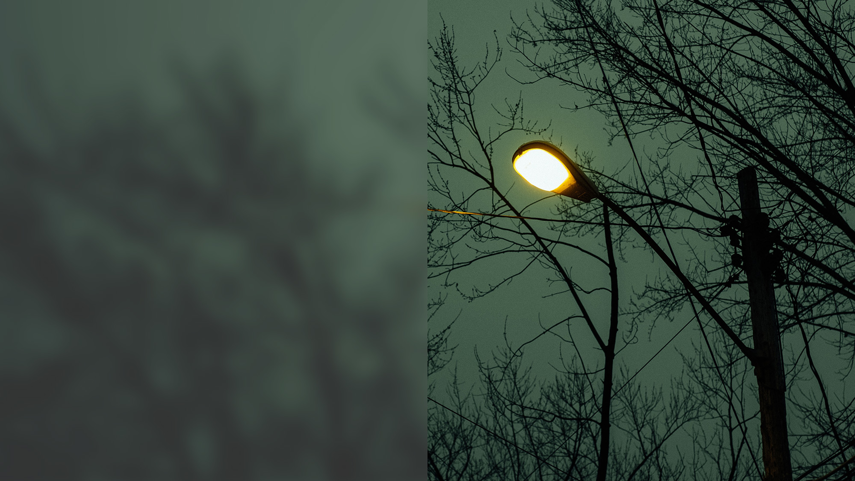 A street light shines in the darkness.