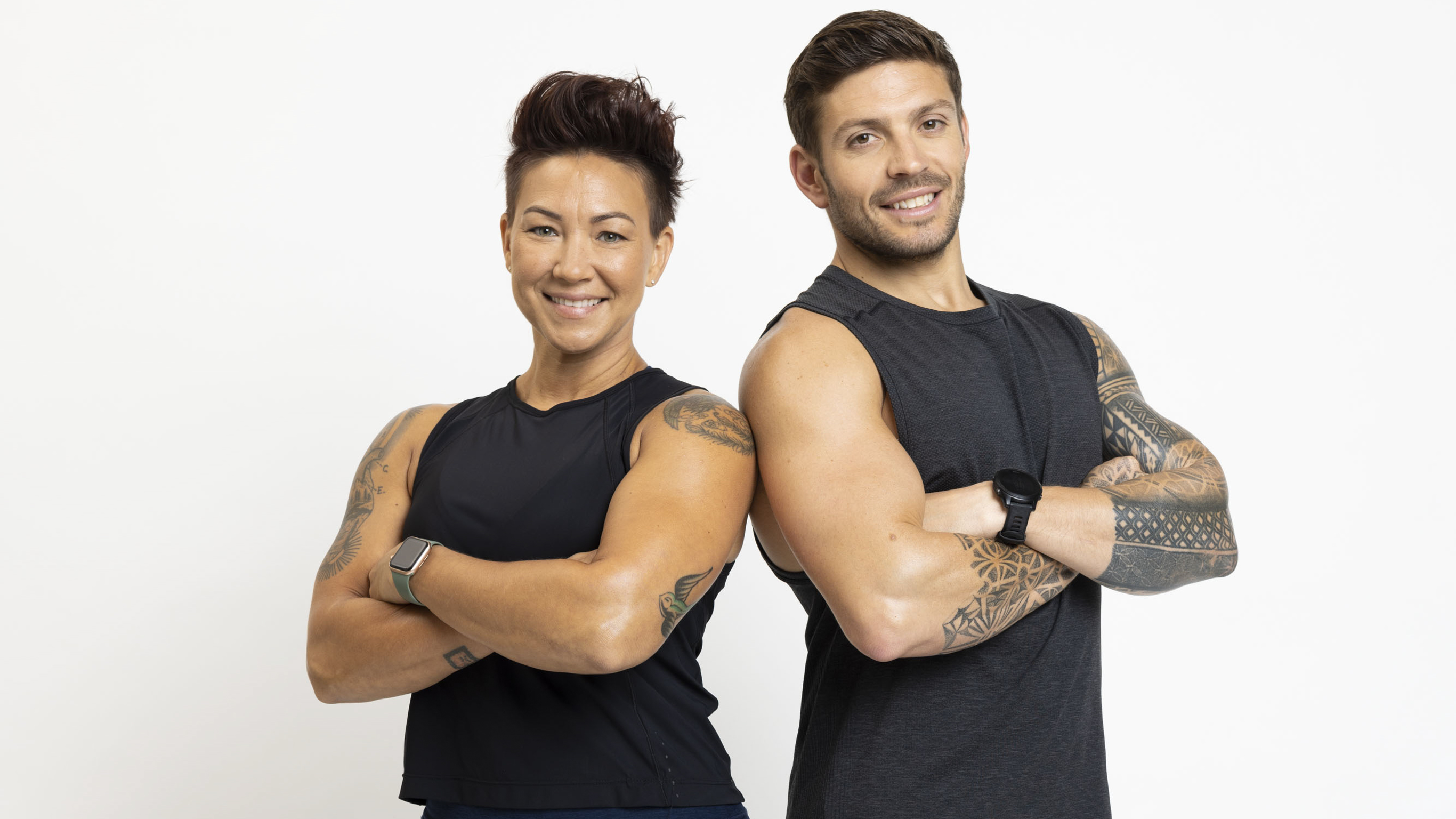 Luke Zocchi and Jess Kilts, Centr's muscle-building experts, stand side by side.