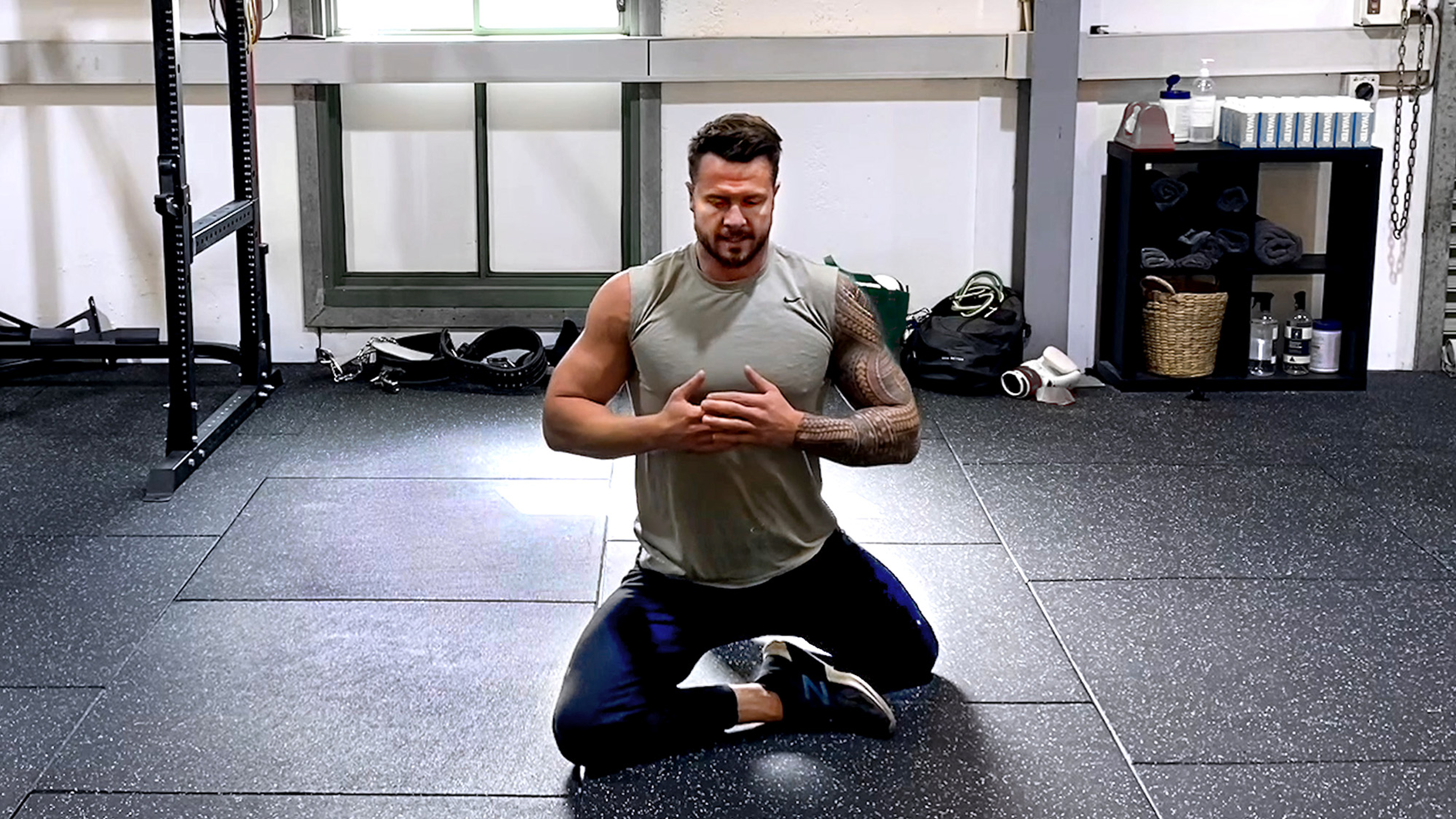 Bobby Holland Hanton performs pigeon pose in the gym