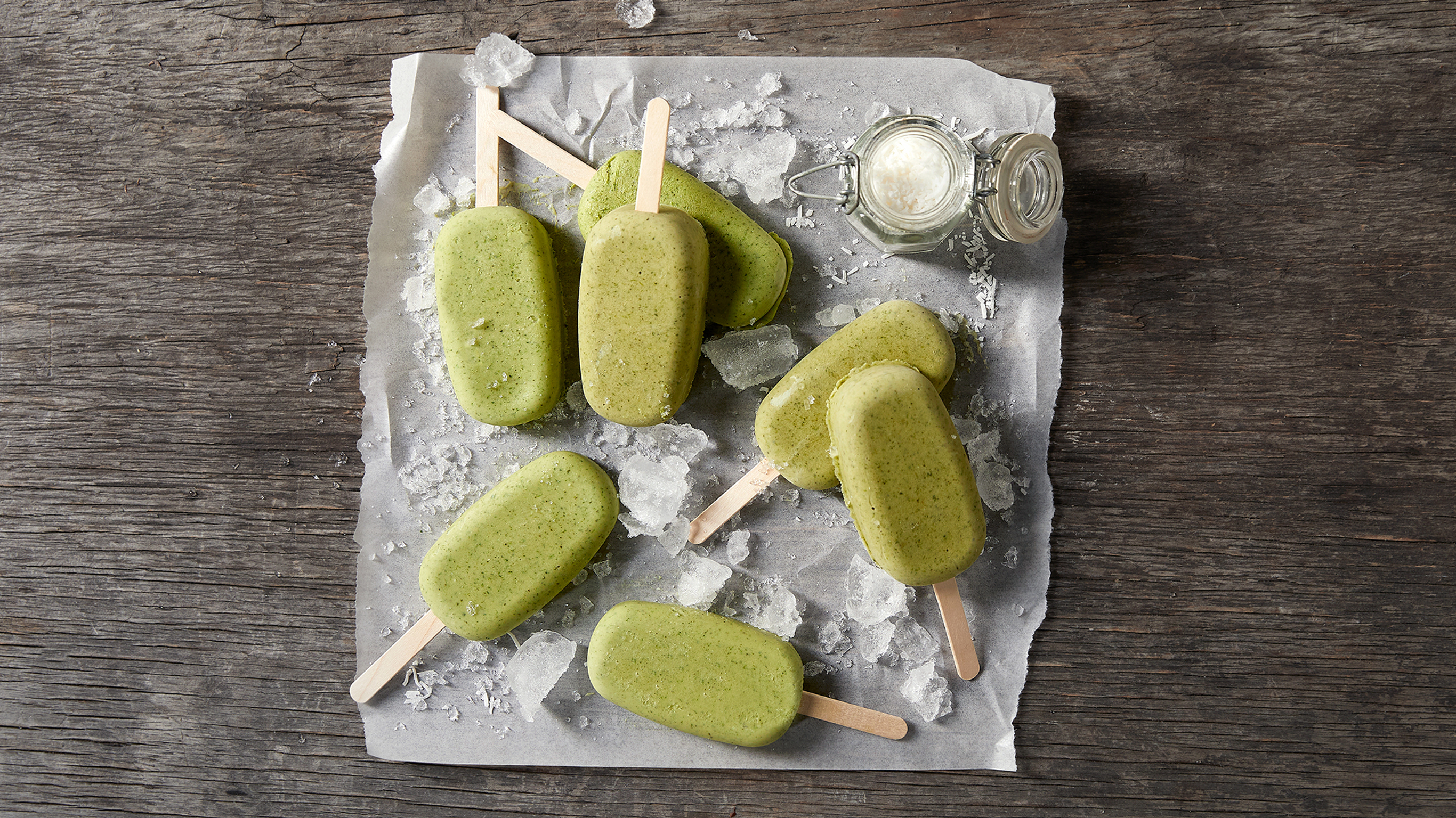 Several Green Machine Frozen Bars, from the Centr meal plan, sit on a table.