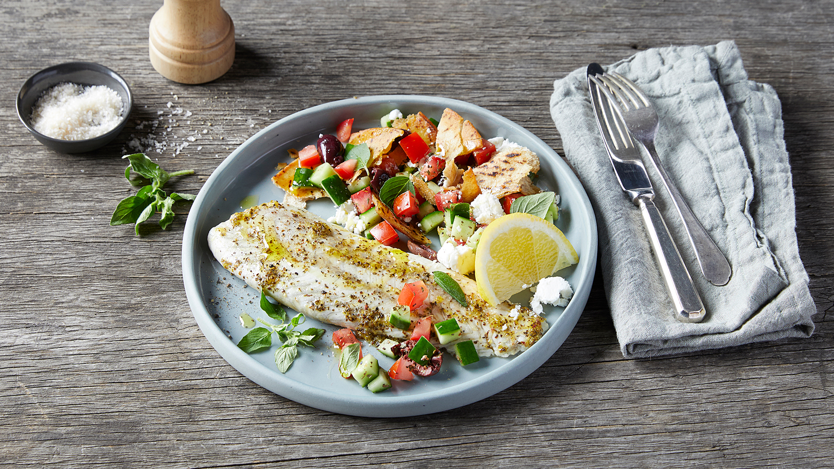 Greek-style Baked Fish with Salad from Centr's meal plan.