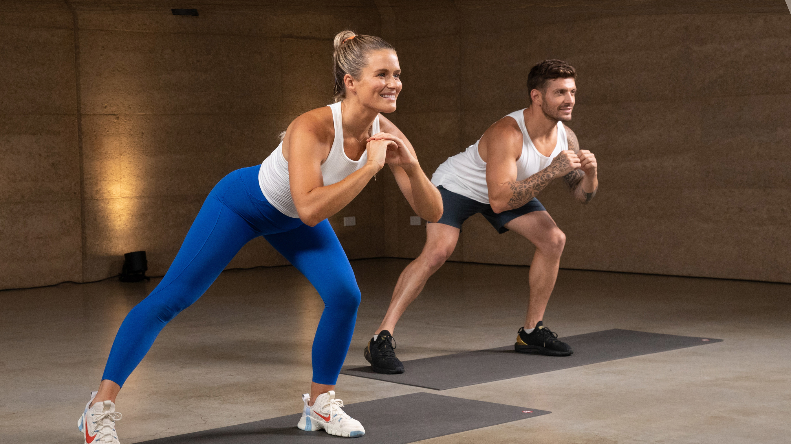 Centr trainers Alexz Parvi and Luke Zocchi perform a lunge movement as part of a midday workout.
