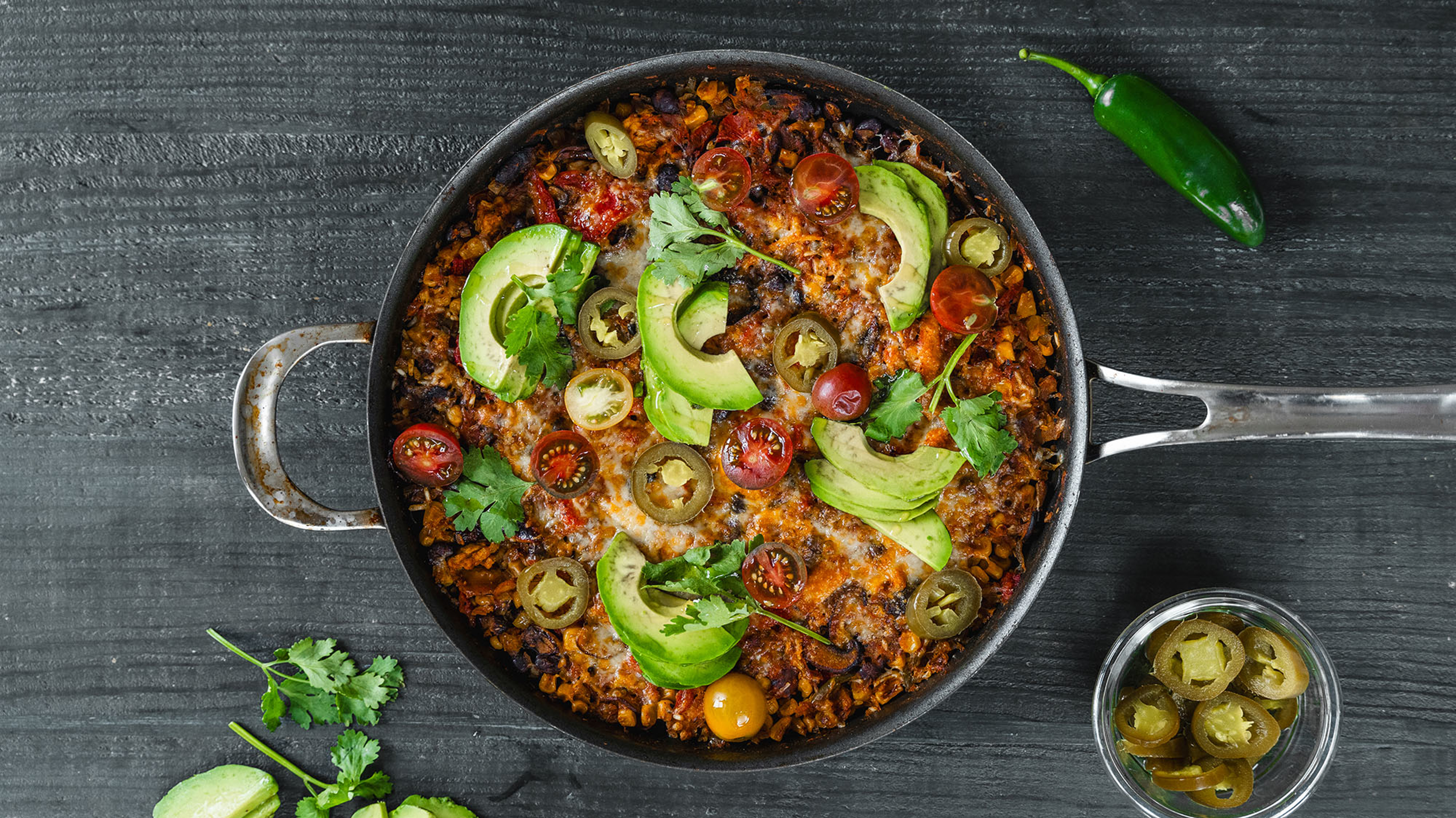 An overhead view of mexican chicken & rice bake in a pan.