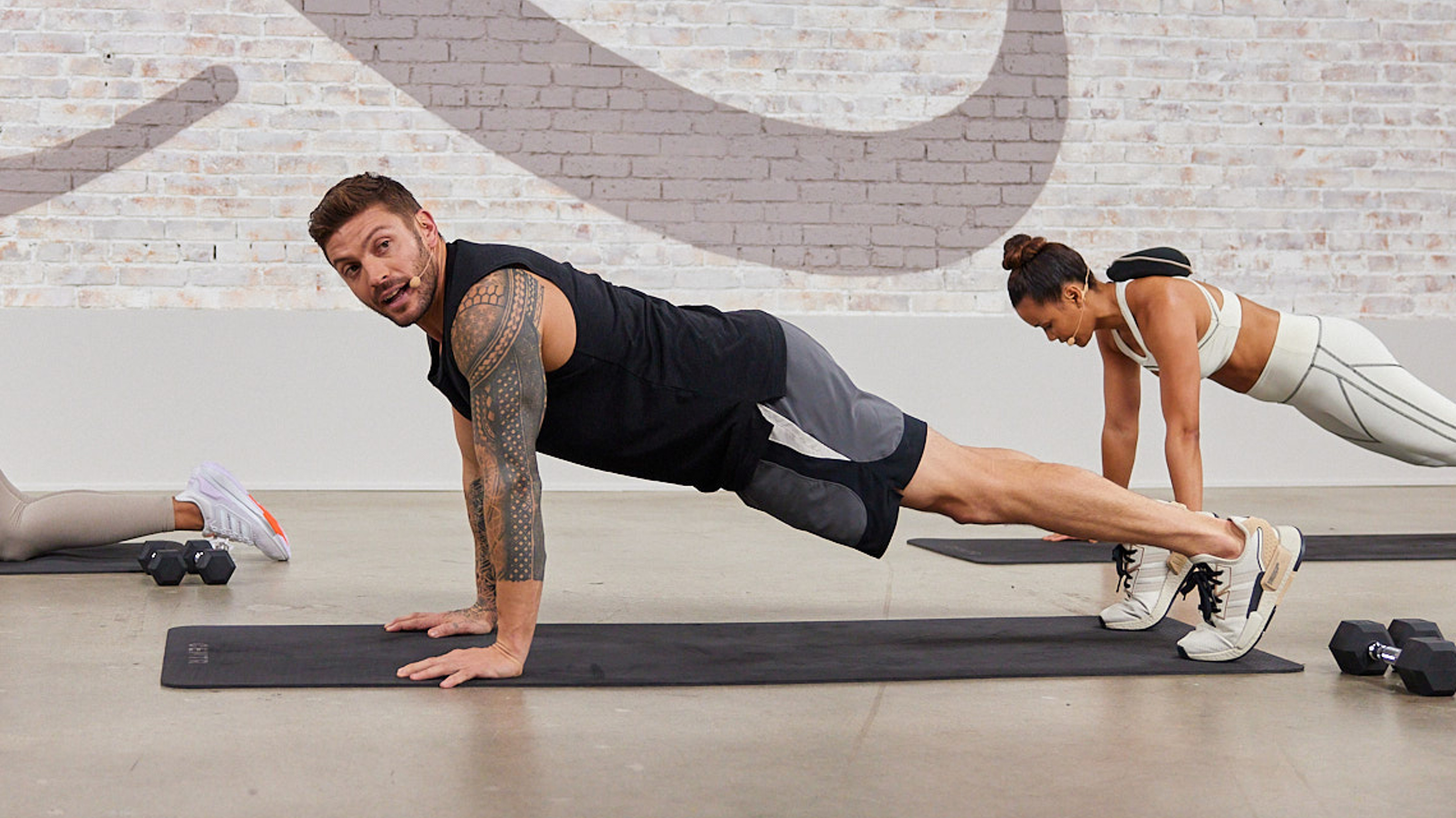 Centr Trainer Luke Zocchi holds a high plank.