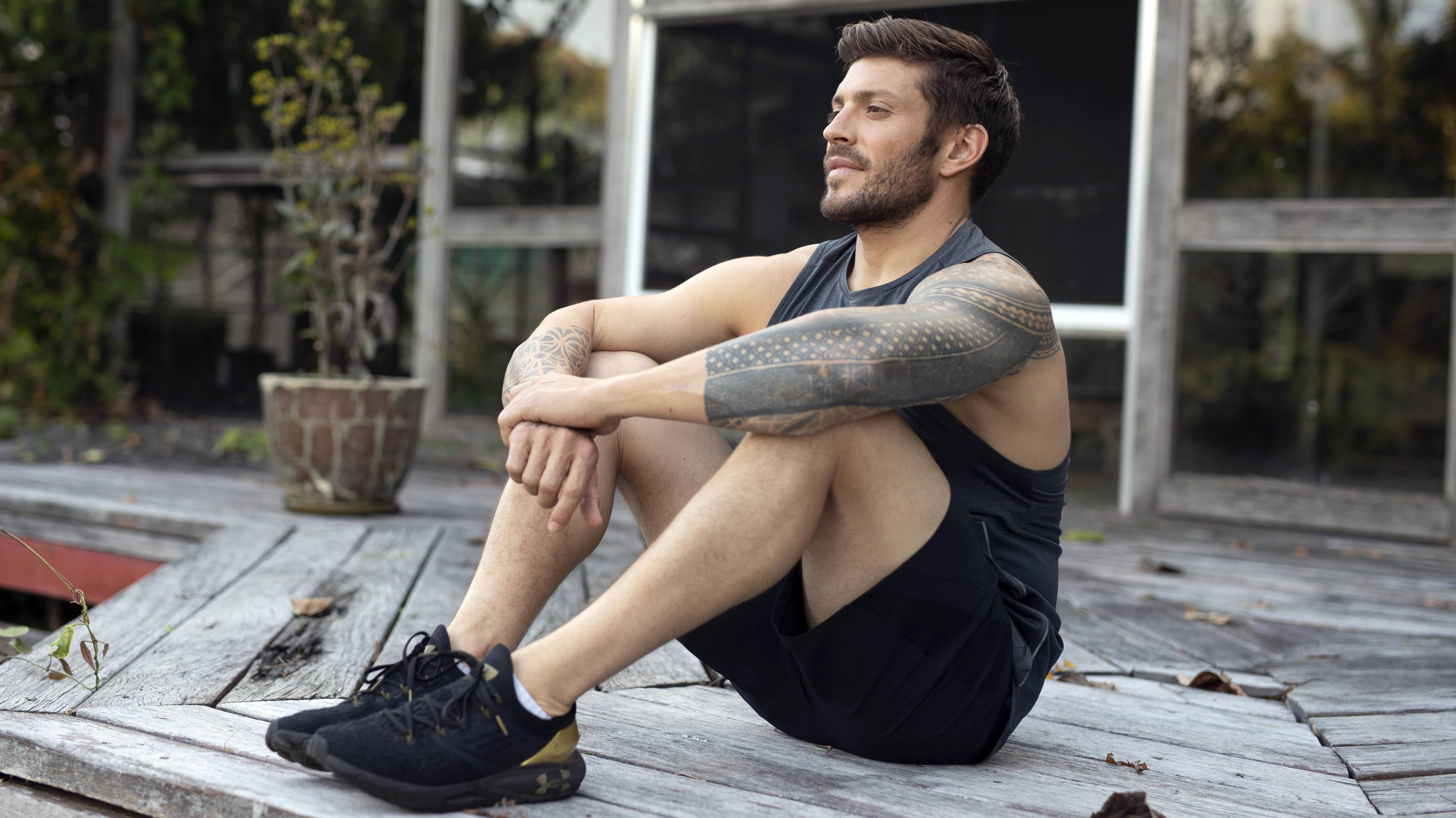 Centr Trainer Luke Zocchi sits on a porch and reflects.