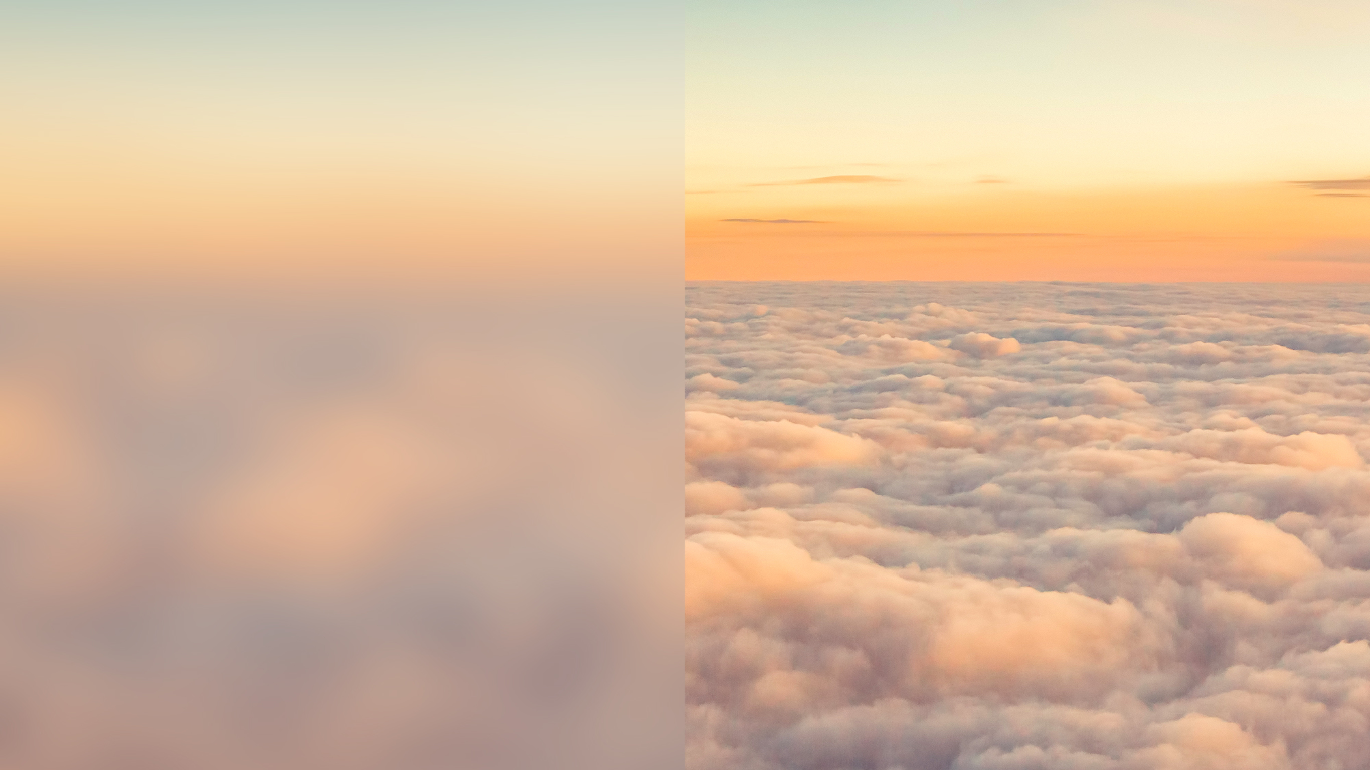An orange sunset masked by an expanse of fluffy clouds.