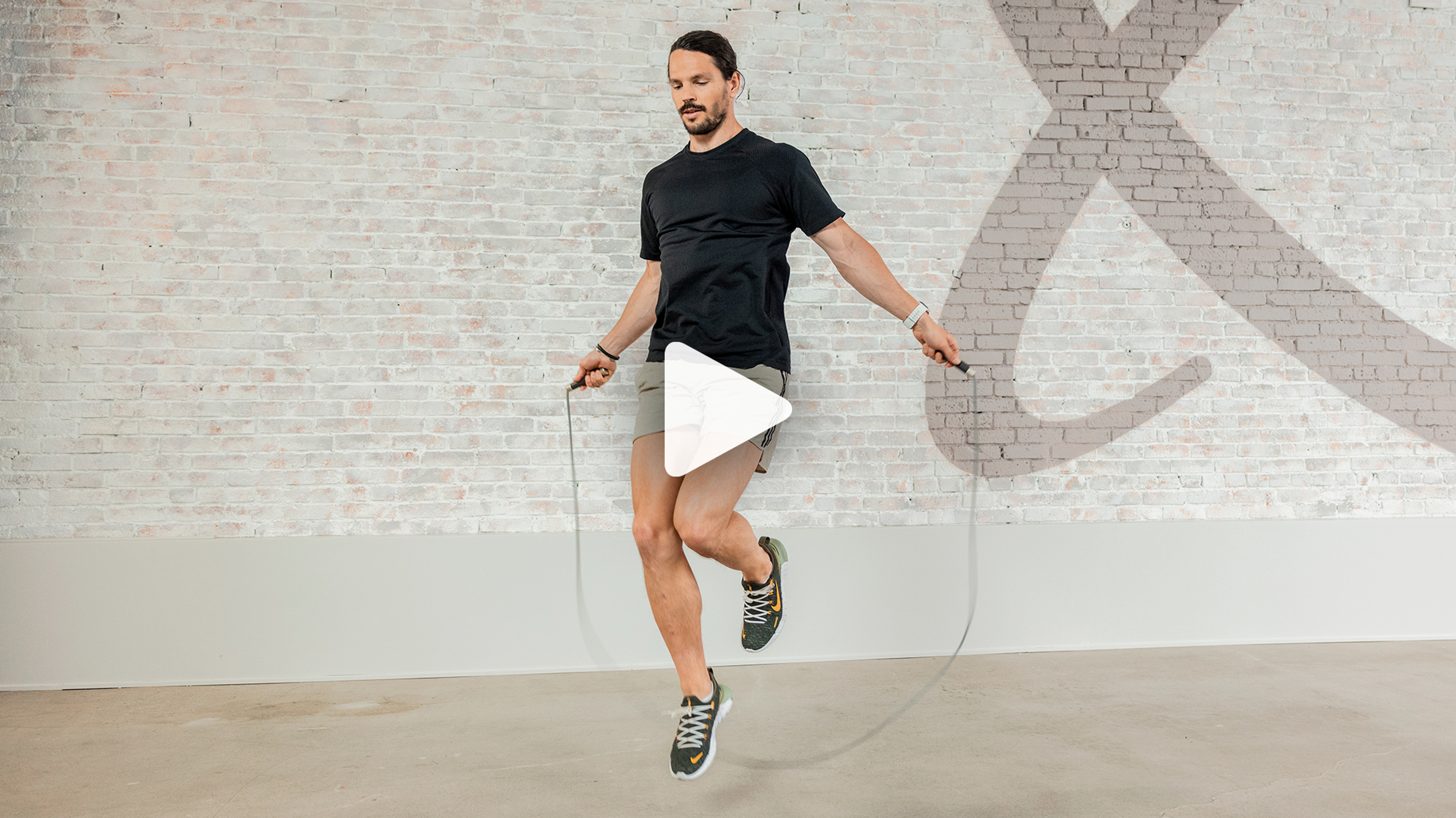 Centr trainer Dan Churchill skips rope in the studio gym