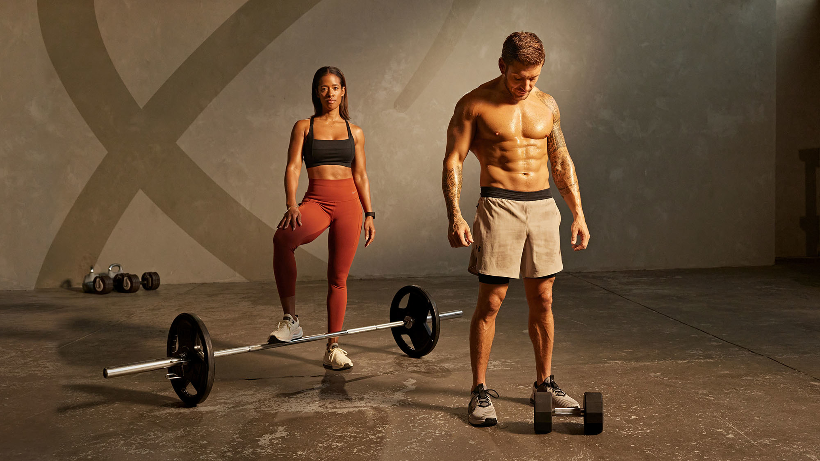 Centr trainers Ingrid Clay and Luke Zocchi strike a powerful pose and show off their shredded physiques.