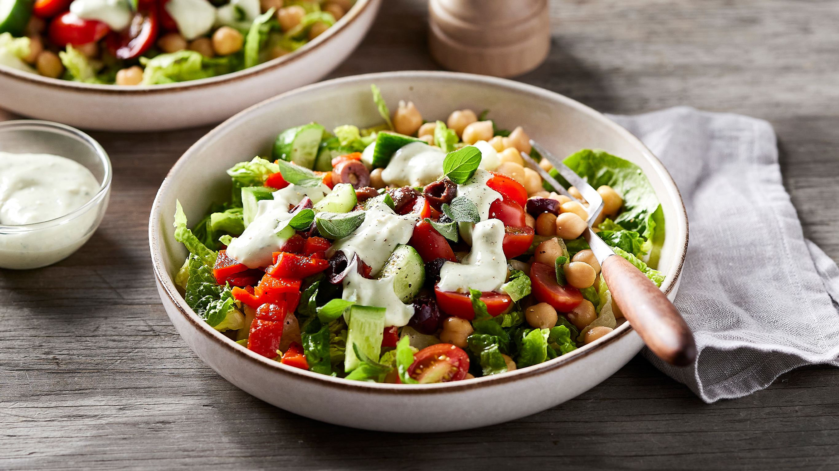 A bowl of Centr's Mediterranean-style Chopped Salad is ready to eat.