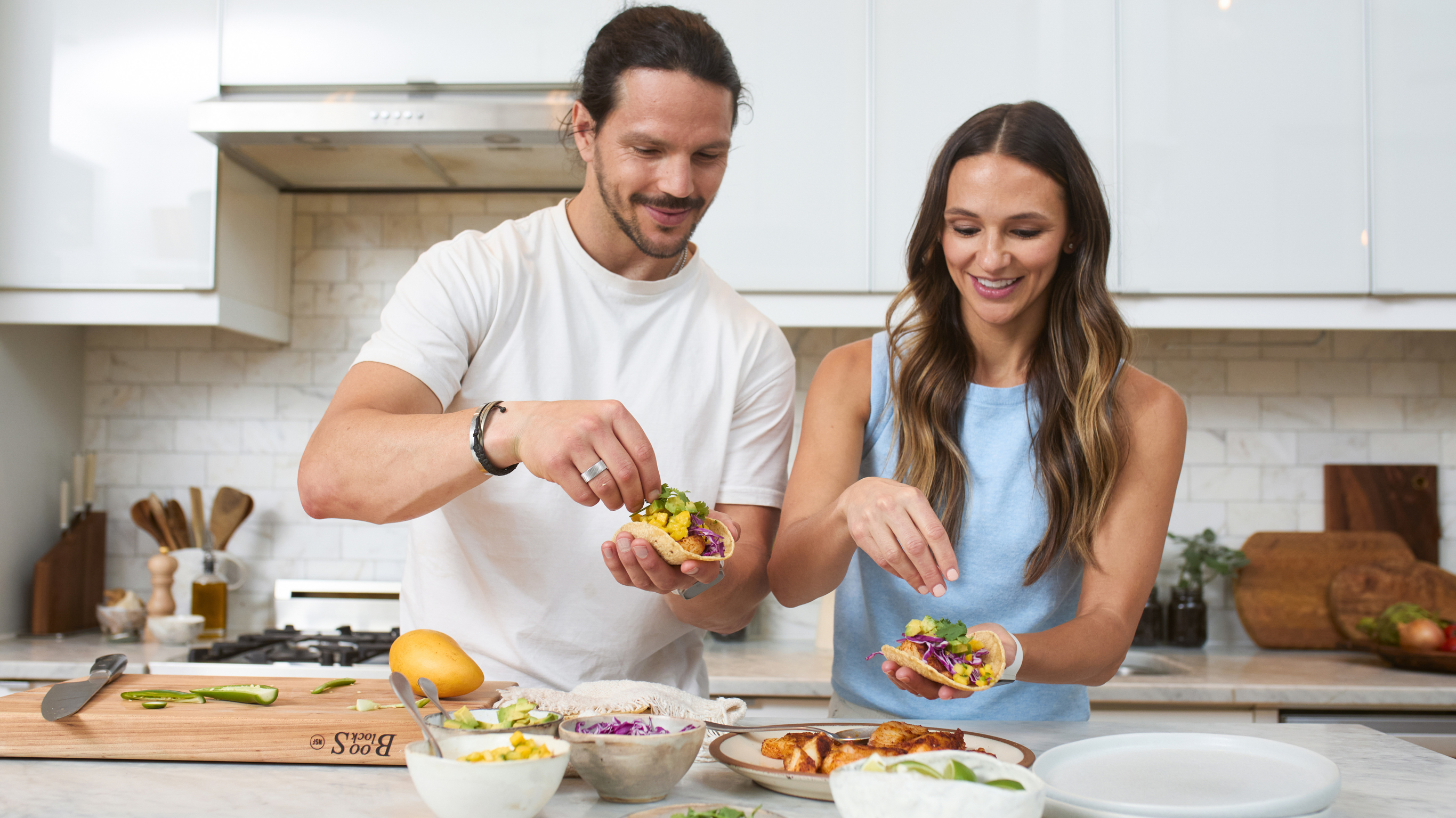 Centr's Angie Asche and Dan Churchill make Fish Tacos from the Centr menu together in the kitchen.