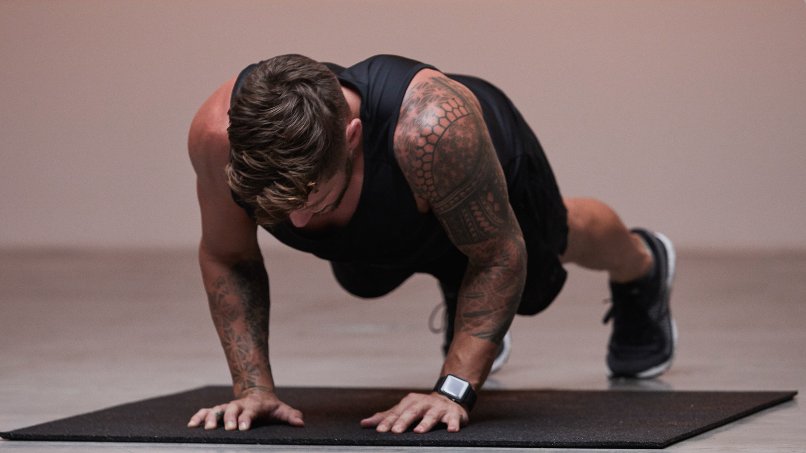 Centr trainer Luke Zocchi performs a push-up.