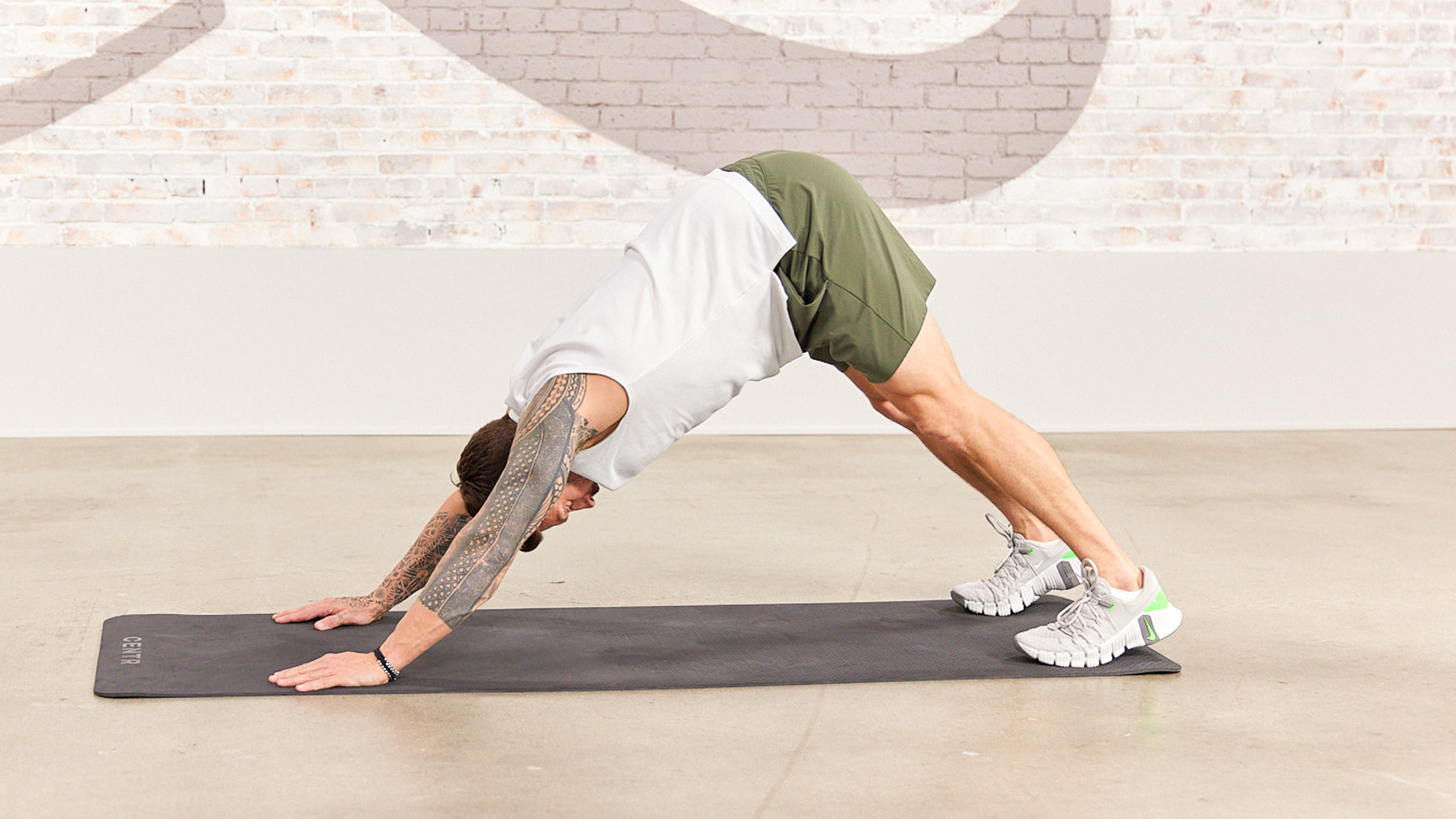 Centr trainer Luke Zocchi performs a pike push-up.