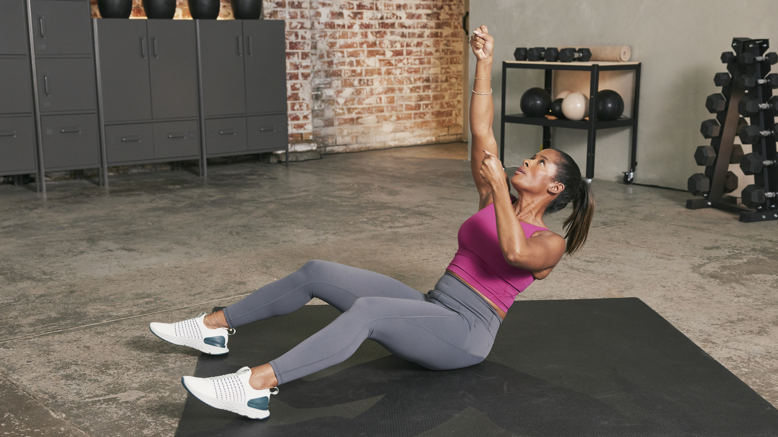 Ingrid Clay performs a climbing rope crunch in the studio gym.