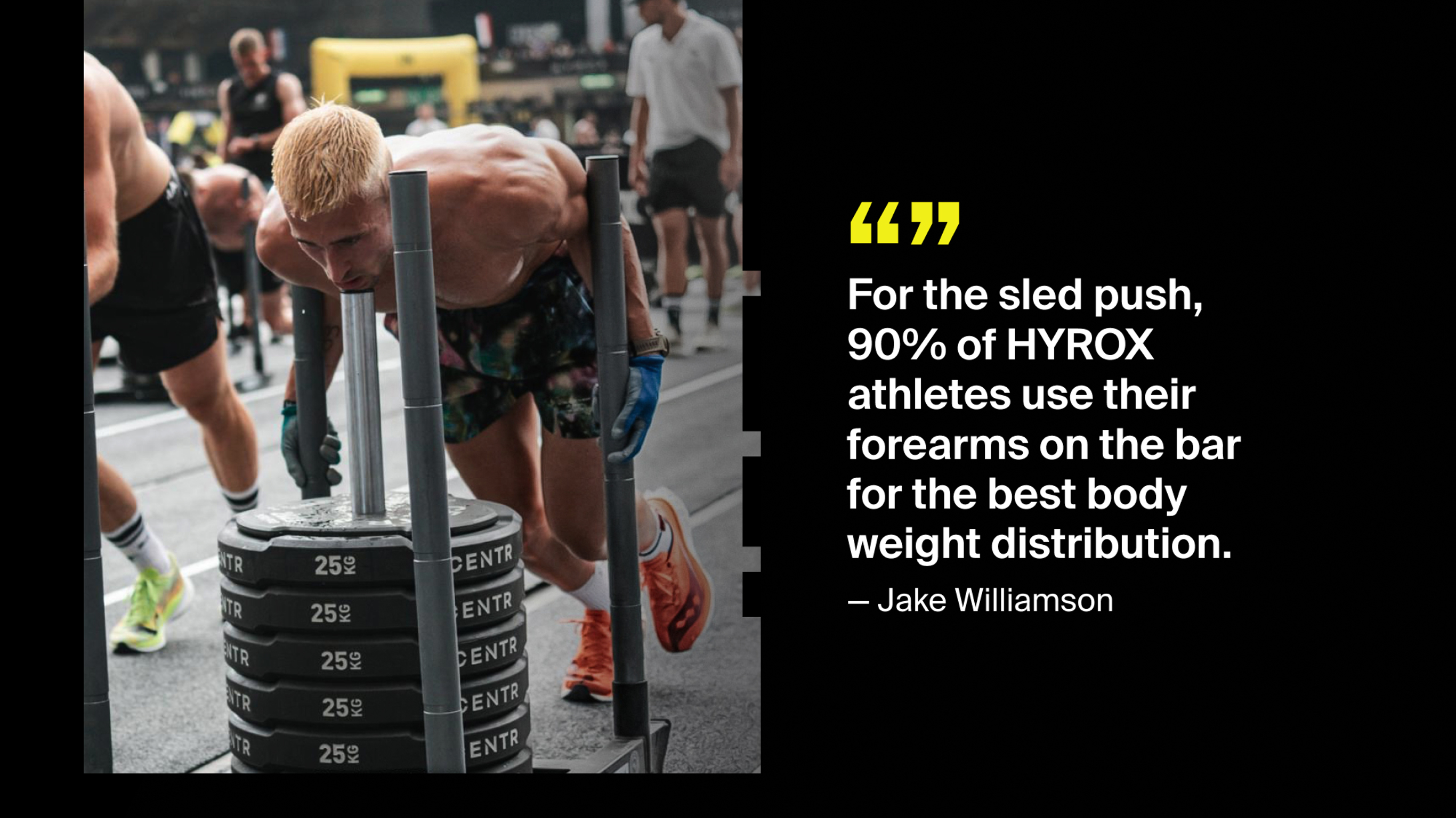 Hyrox pro athlete ake Williamson performs the sled push at a Hyrox competitor