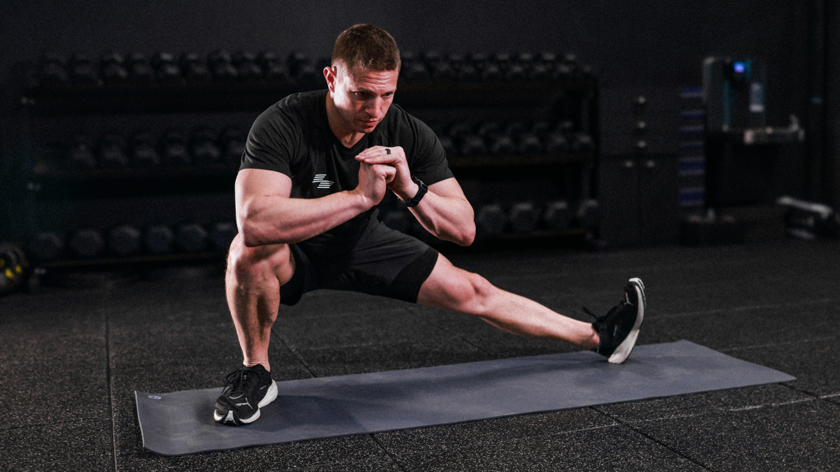 Hyrox champion David Magida performs a side lunge