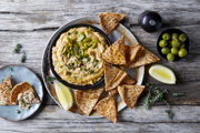 Lemon &amp; Thyme Baked Hummus with Olives &amp; Pita