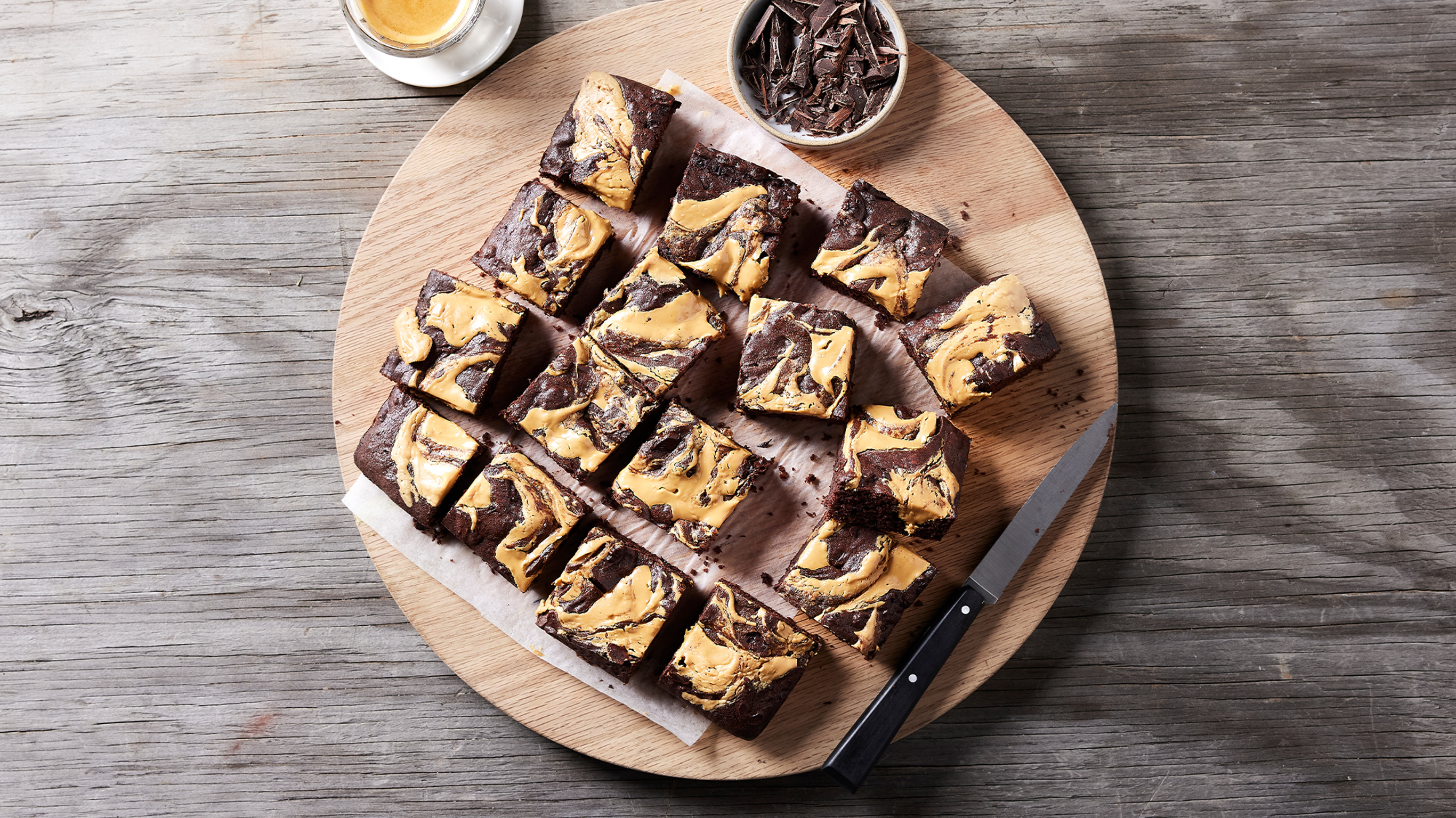 A stray of Centr's Peanut Butter Swirl Brownies is sliced and ready to eat.