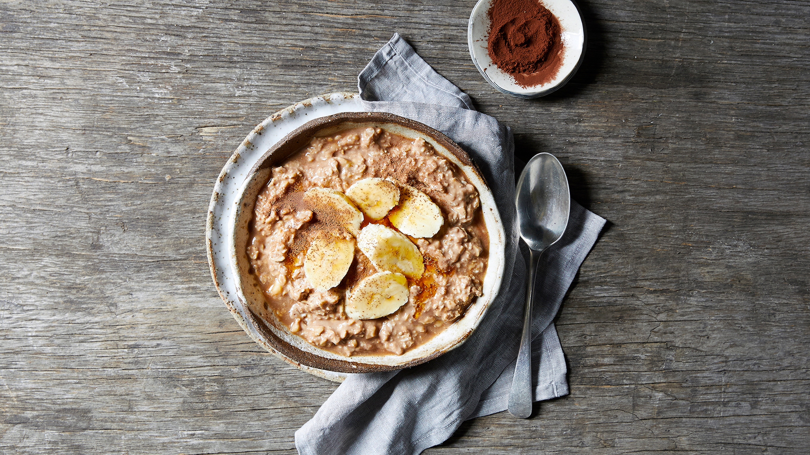 A large bowl of Choc Banana Protein Oatmeal from the Centr meal plan.